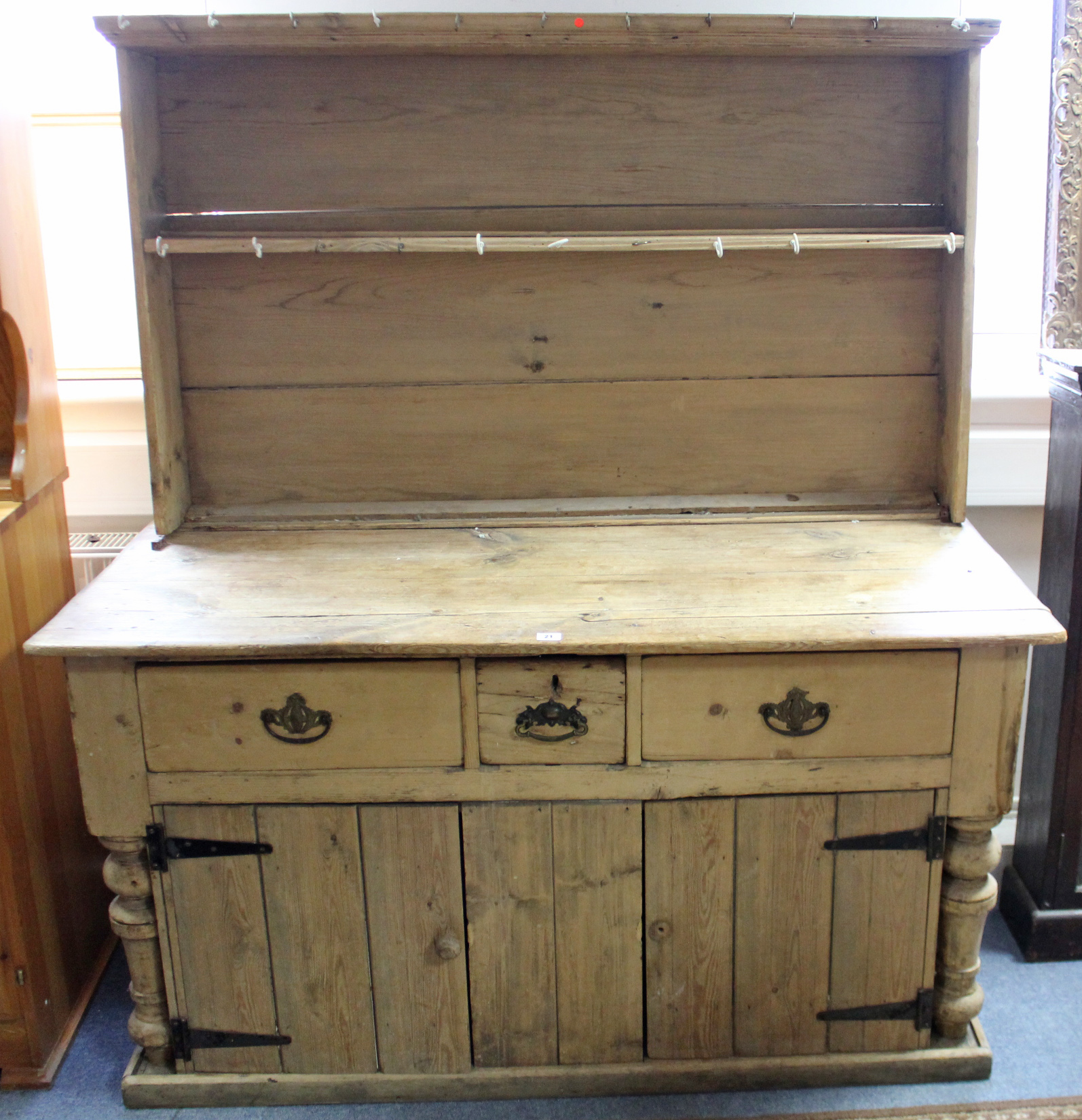 A Victorian-style pine kitchen dresser, the upper part fitted centre shelf & with panelled back, the