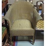 A Lusty’s Lloyd Loom gold painted basket chair.