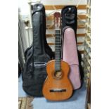 Four six-string acoustic guitars; & a modern violin.