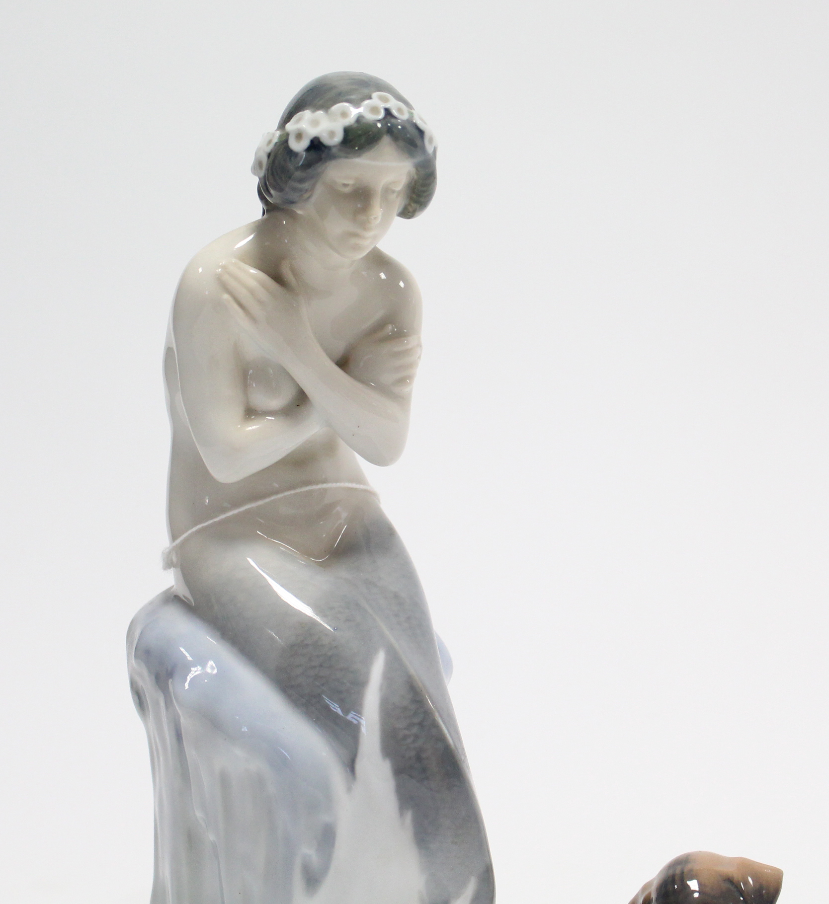 A Royal Copenhagen porcelain ornament in the form of a mermaid seated on an ice rock (No.1210), - Image 2 of 6