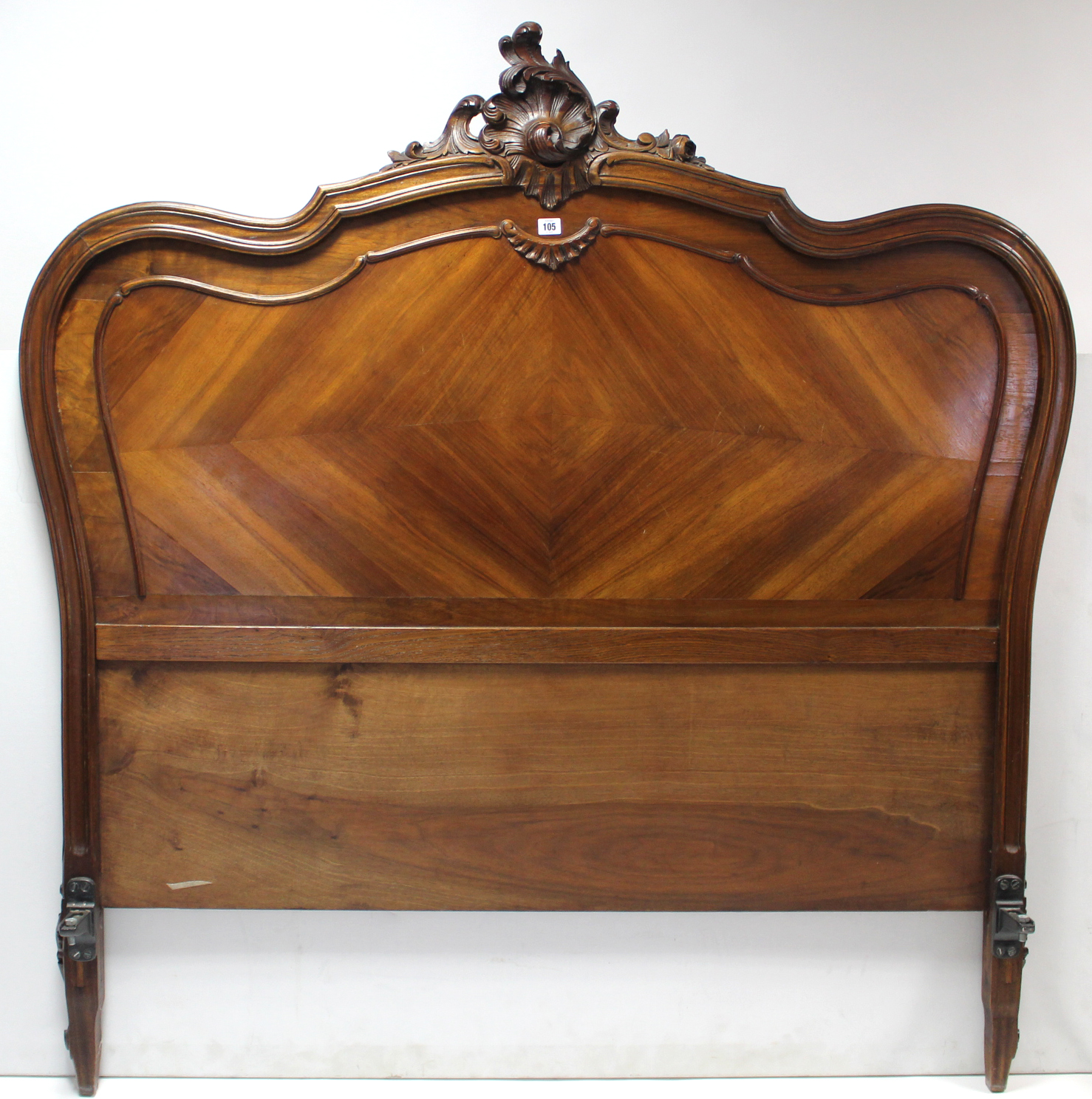 A continental-style carved walnut 5; bedstead with shaped head & footboard, complete with side