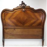 A continental-style carved walnut 5; bedstead with shaped head & footboard, complete with side