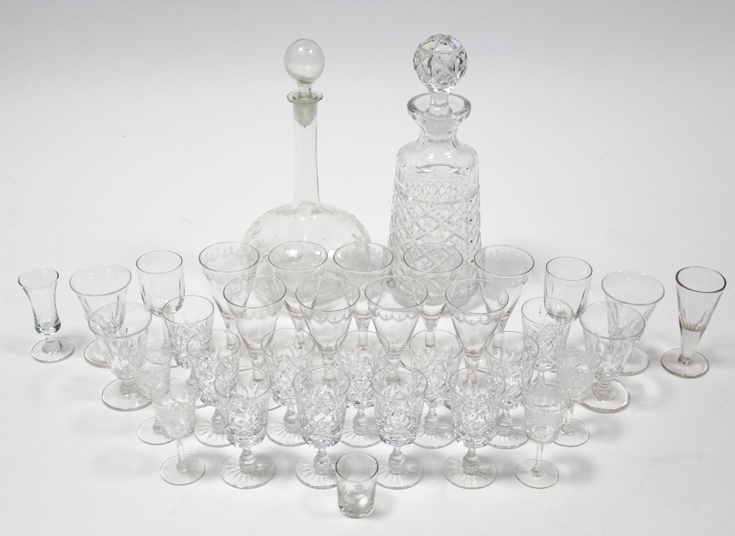 A heavy cut-glass mallet-shaped decanter; a glass bulbous-shaped decanter; various drinking vessels; - Image 2 of 2