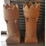 A pair of terracotta chimney pots (w.a.f.), 37½” high.