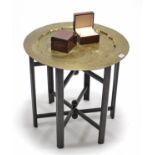 An eastern brass engraved tray-top occasional table on folding wooden stand; & twenty-two modern