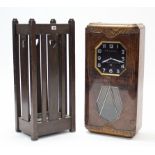 A 1930’s oak umbrella stand; a mid-20th century wall clock; & an antique set of coat hooks.