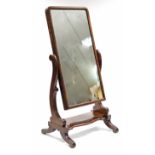 A mid-Victorian mahogany cheval mirror, the rectangular plate on scroll supports & platform base