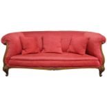 A 19th century carved walnut-frame Chesterfield type three-seater sofa, upholstered pink corduroy,