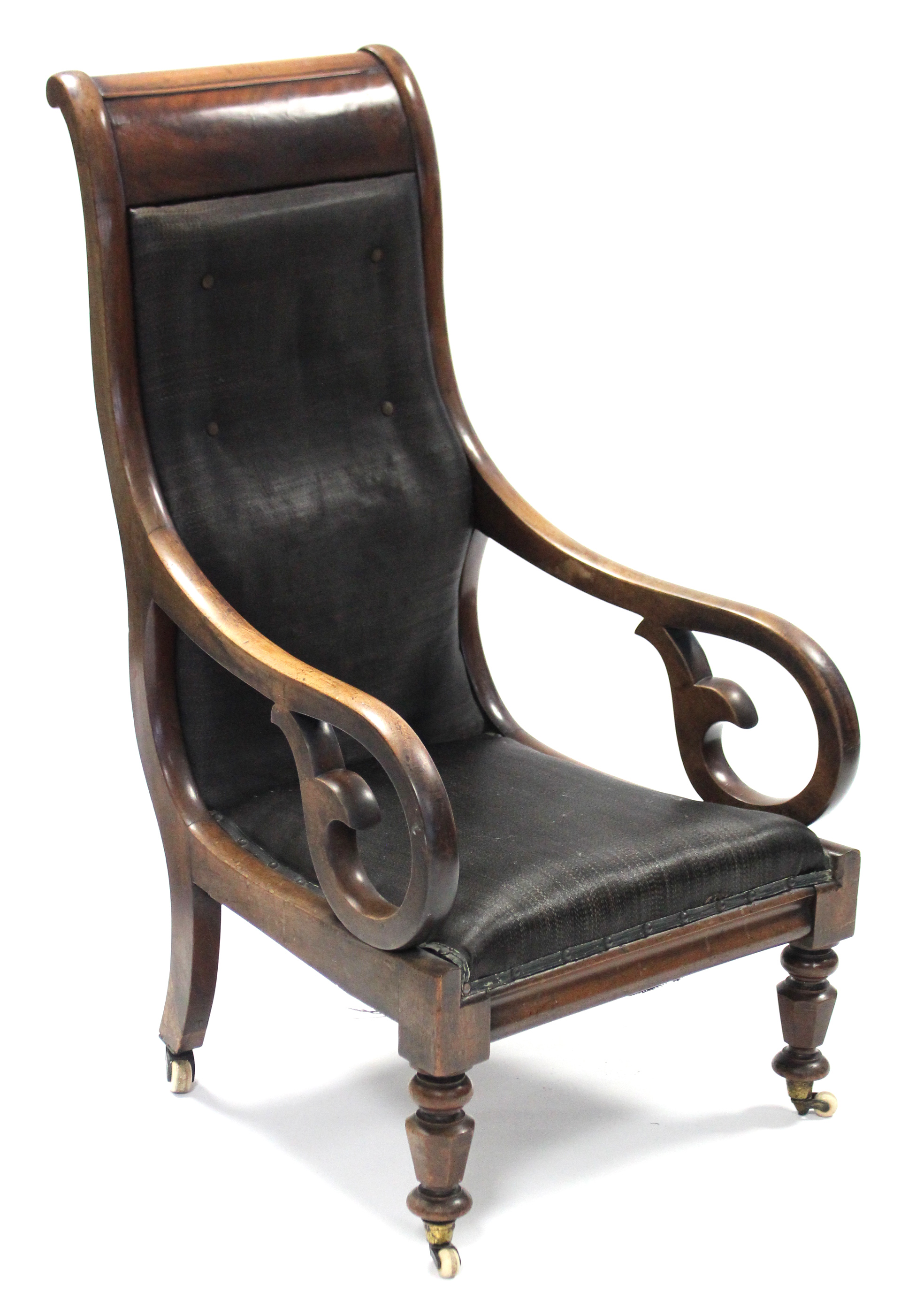 A William IV mahogany library armchair, with open scroll arms, padded seat & tall buttoned-back