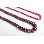 A ruby necklace of graduated opaque faceted beads, 19½” long; & a similar necklace of smaller