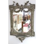 A 19th century French wall mirror, the rectangular bevelled plate with canted corners, in foliate-