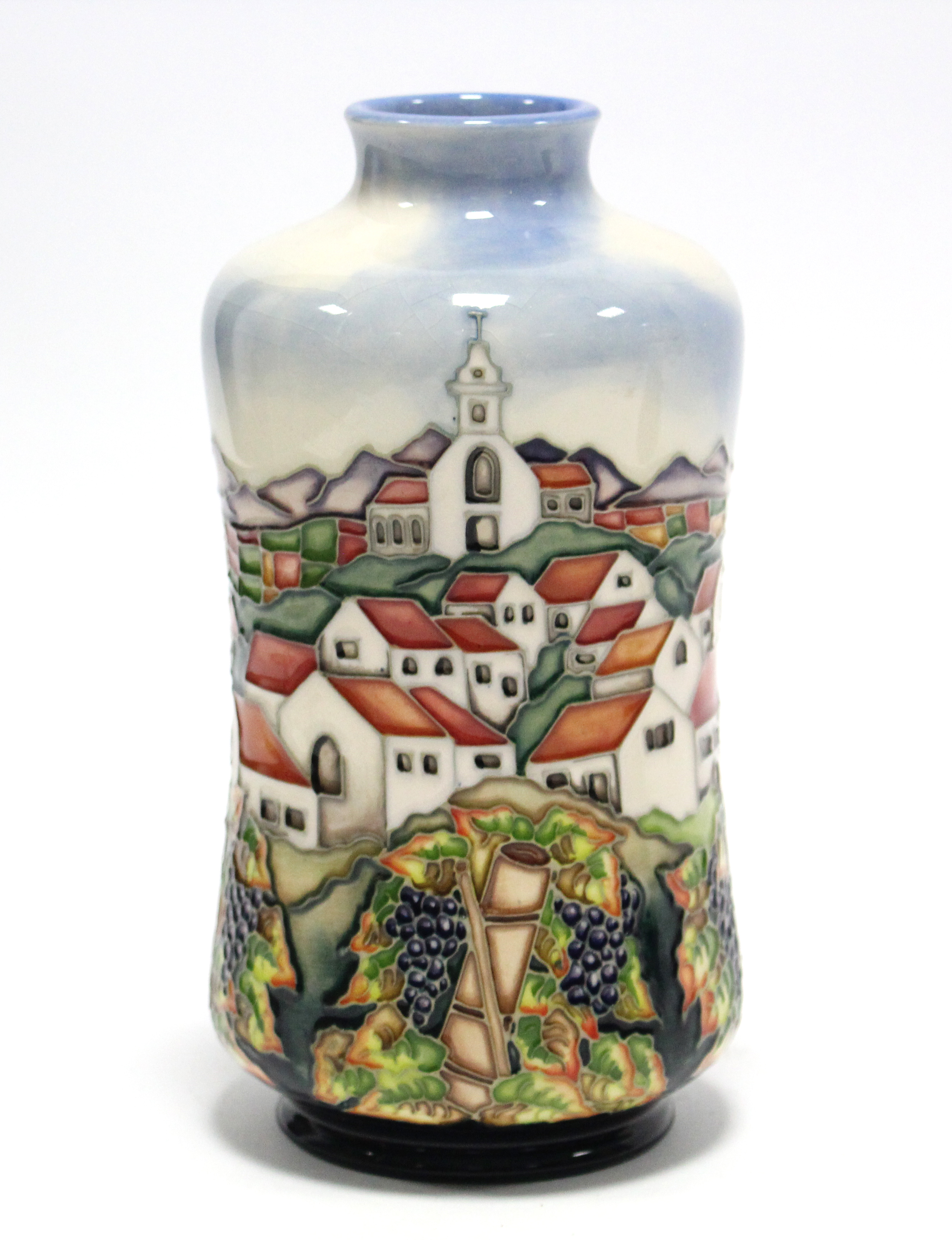 A Moorcroft pottery “Andalucia” vase designed by Beverley Wilkes, decorated with fruiting vines