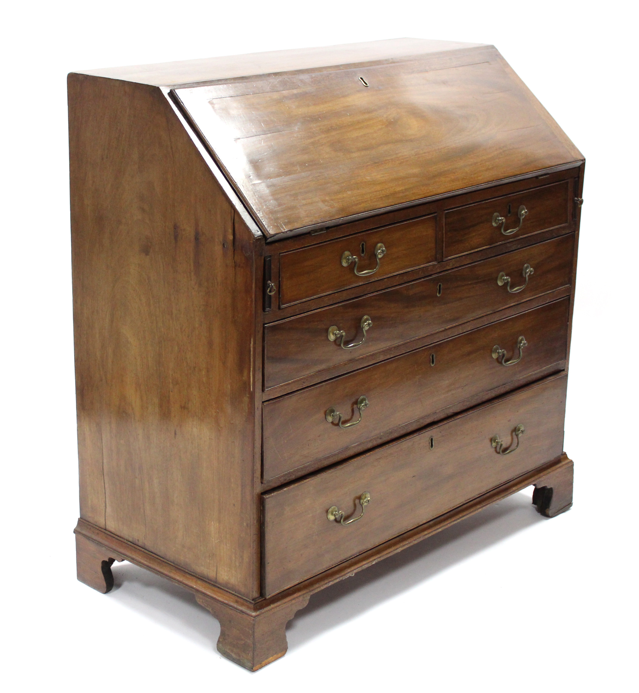 A late 18th century mahogany bureau, with fall-front enclosing fitted interior above two short &