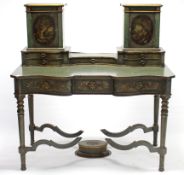 A 19th century French painted serpentine-front dressing table, the stage back fitted five