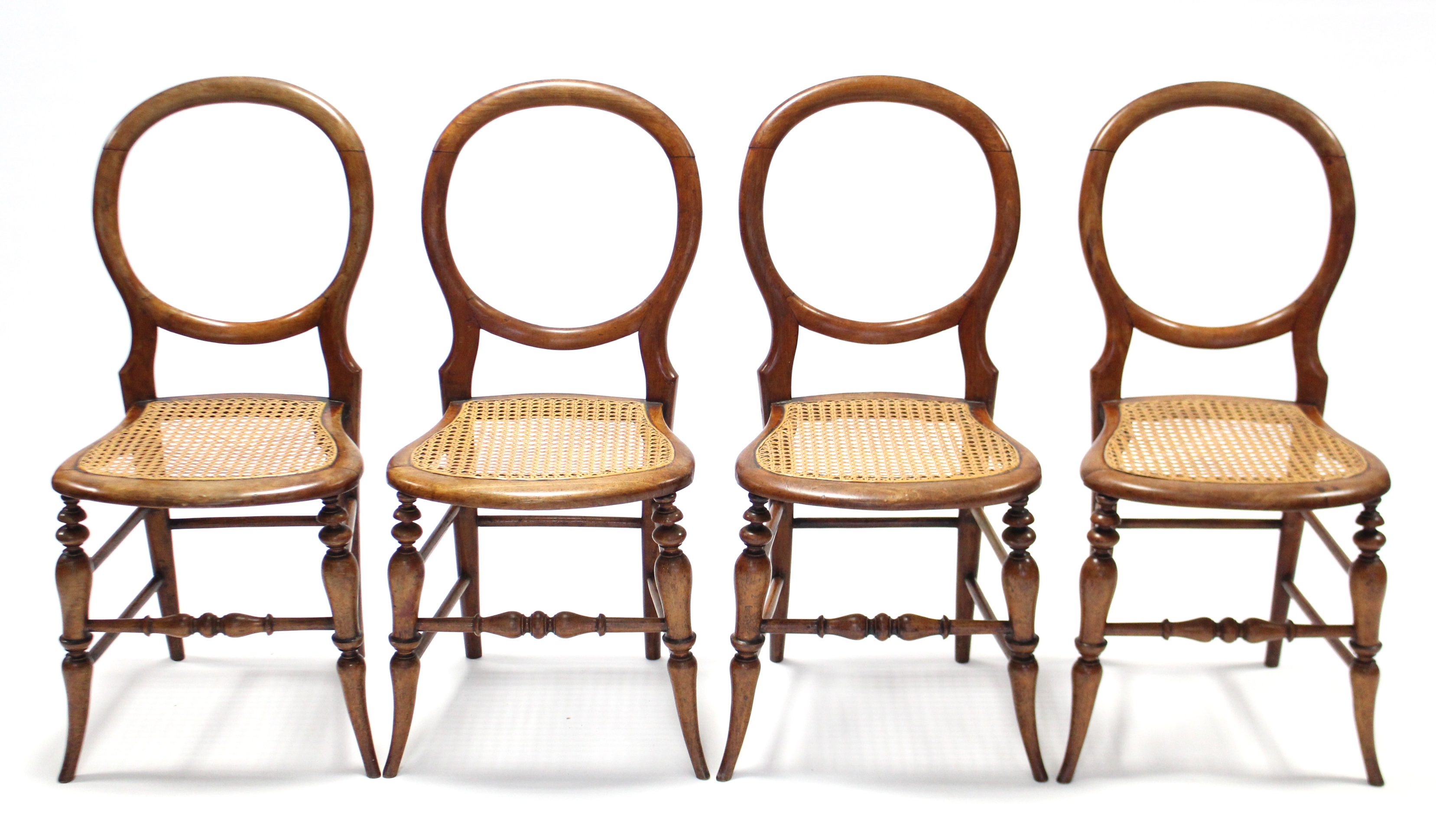 A set of four stained beech balloon-back side chairs with open backs & woven cane seats, on - Image 2 of 2