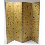 A four-fold draught screen with all-over painted decoration simulating 17th century silk embroidery,