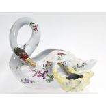 A GALLÉ FAIENCE BOWL IN THE FORM OF A SWAN, its neck looped downwards toward two cygnets at her