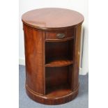A reproduction mahogany-finish circiular revolving bookcase, fitted three frieze drawers