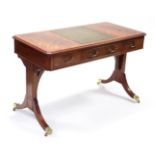 A mahogany-finish reproduction writing desk, the rectangular top with canted corners & inset central