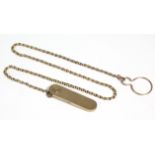 A retractable door key in 9ct. gold reeded flat rectangular case with rounded ends, London hallmarks