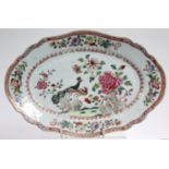 AN 18th century CHINESE FAMILLE ROSE PORCELAIN “DOUBLE PEACOCK” OVAL DISH with shaped rim, 11” x