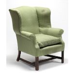 A late Georgian wing-back armchair, upholstered chequered green fabric, on square legs with plain