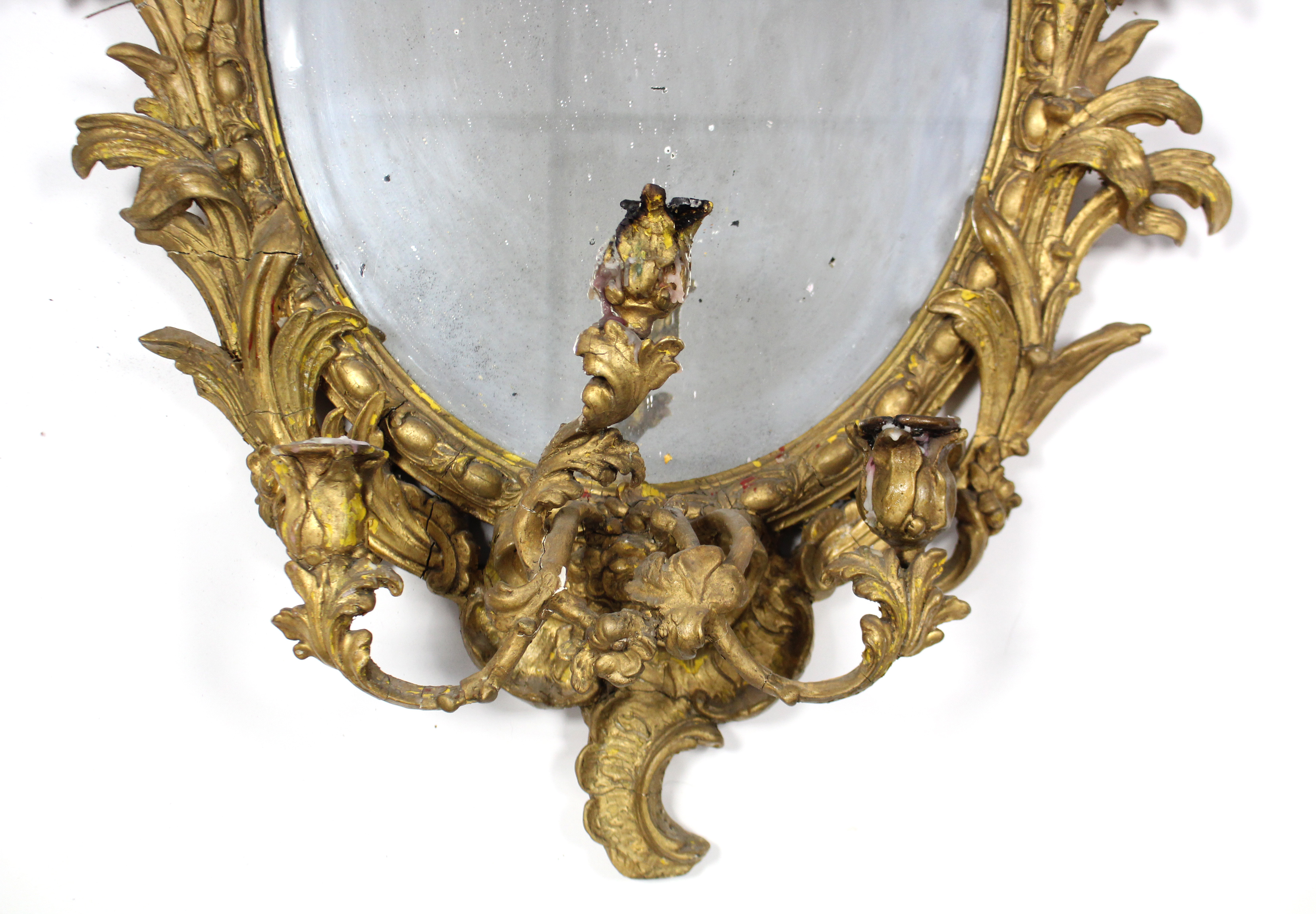 An early 19th century girandole, the oval mirror plate in gilt gesso rococo frame with floral - Image 2 of 5