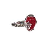 A SPINEL & DIAMOND RING, the natural red transparent cabochon spinel weighing approximately 16
