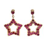 A PAIR OF RUBY PENDANT EARRINGS, each of open five-pointed star shape, set twenty round-cut stones