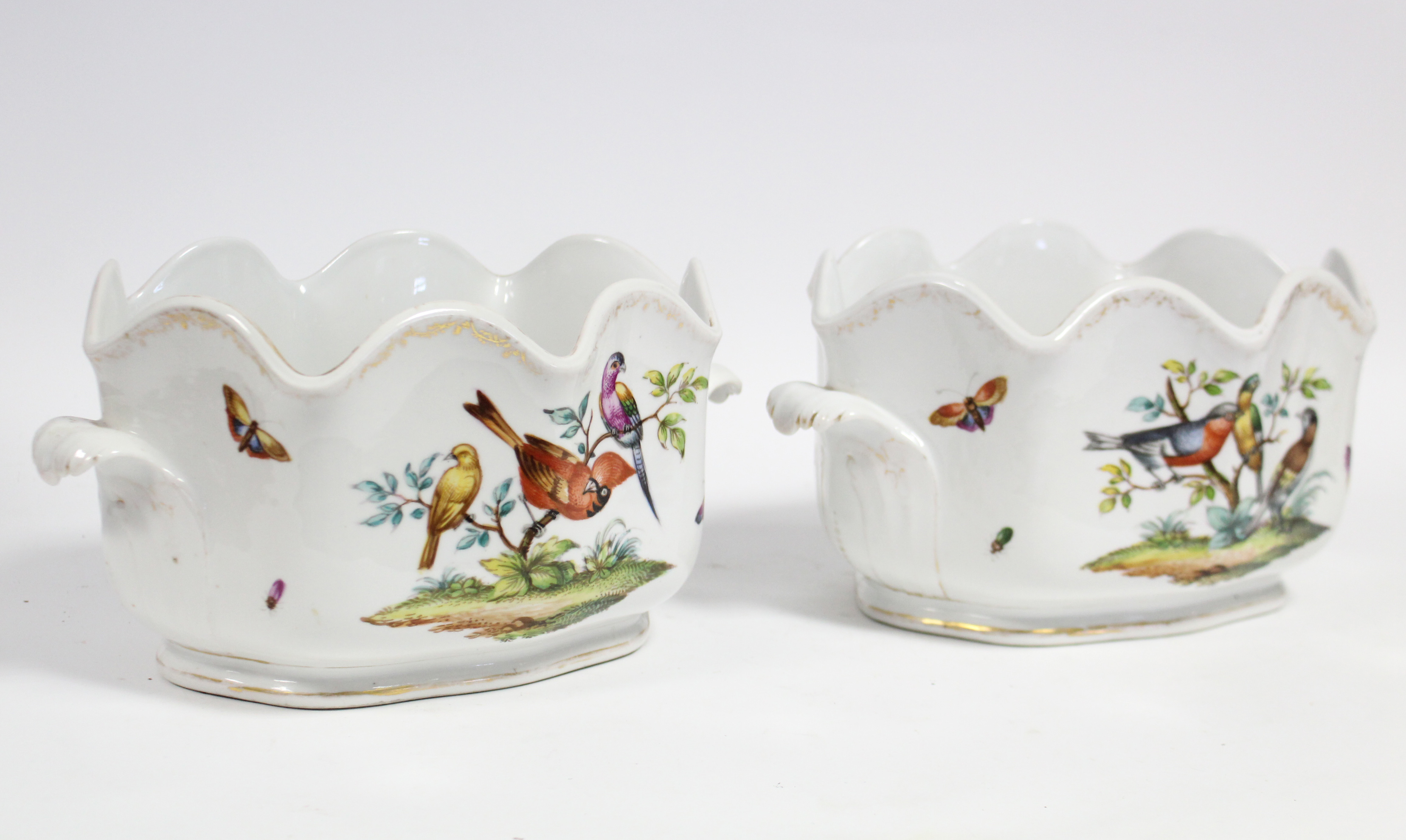 A pair of Dresden porcelain “Augustus Rex” oval two-handled wine coolers, each painted with exotic