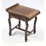 A Chinese hardwood small stool with all-over carved bamboo decoration, shaped rectangular seat &