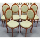 A set of six reproduction carved side chairs with padded seats & oval shaped padded backs, on