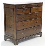 An early 18th century large oak chest, fitted full-width shallow drawer above two short & three long