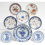 A pair of 18th century Chinese blue-&-white porcelain “Nanking Cargo” saucers painted with pine