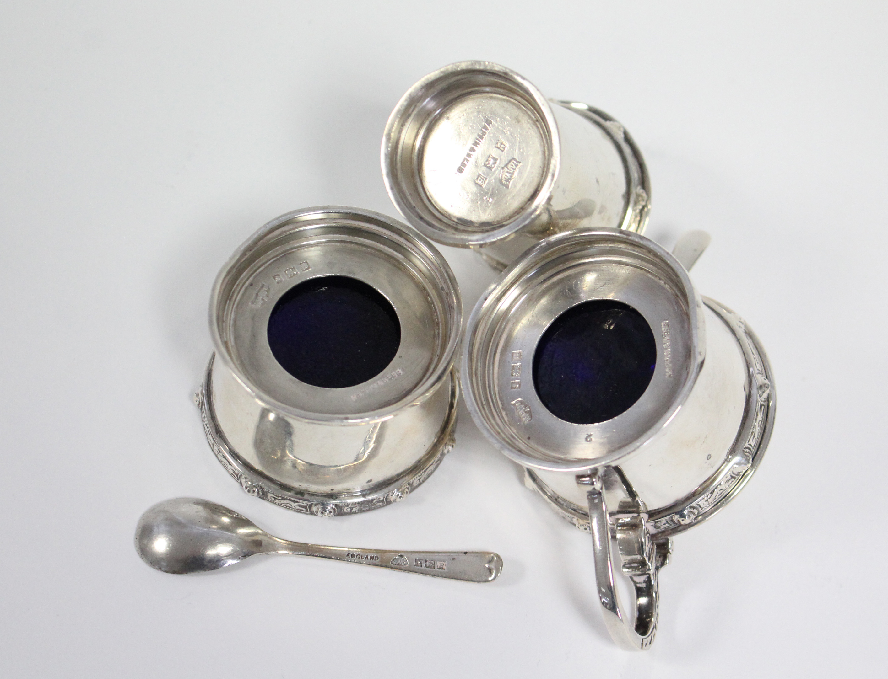 A modern silver three-piece condiment set, each of round tapered form with raised border of Celtic - Image 3 of 3