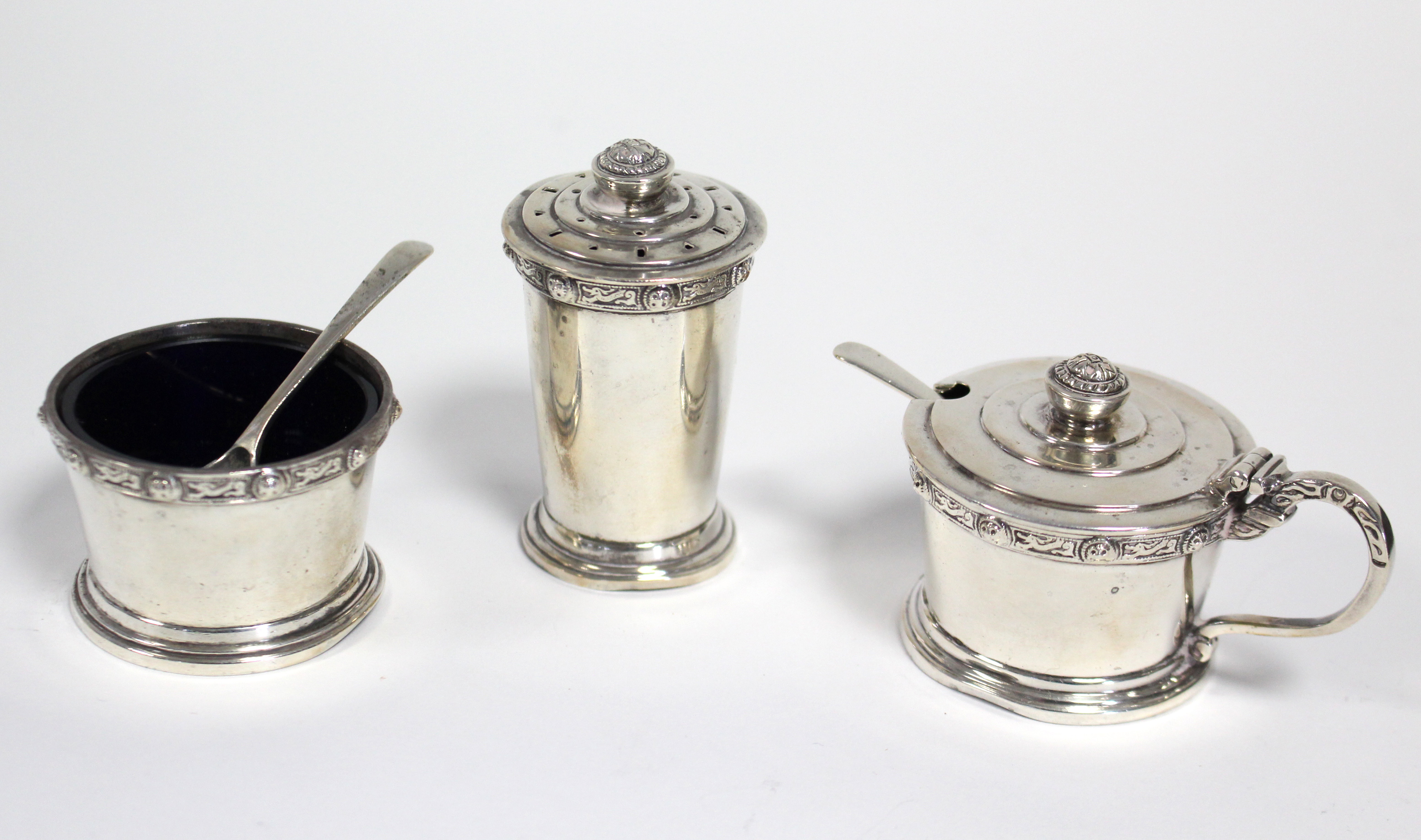 A modern silver three-piece condiment set, each of round tapered form with raised border of Celtic - Image 2 of 3