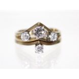 A diamond ring, the four graduated stones set in a tiered arrangement, the largest approx. 0.25