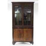 A George III inlaid mahogany & oak standing corner display cabinet, with cavetto cornice, fitted