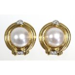 A pair of large mabe pearl earrings, each pearl approx. 13mm diam., set to a wide moulded yellow