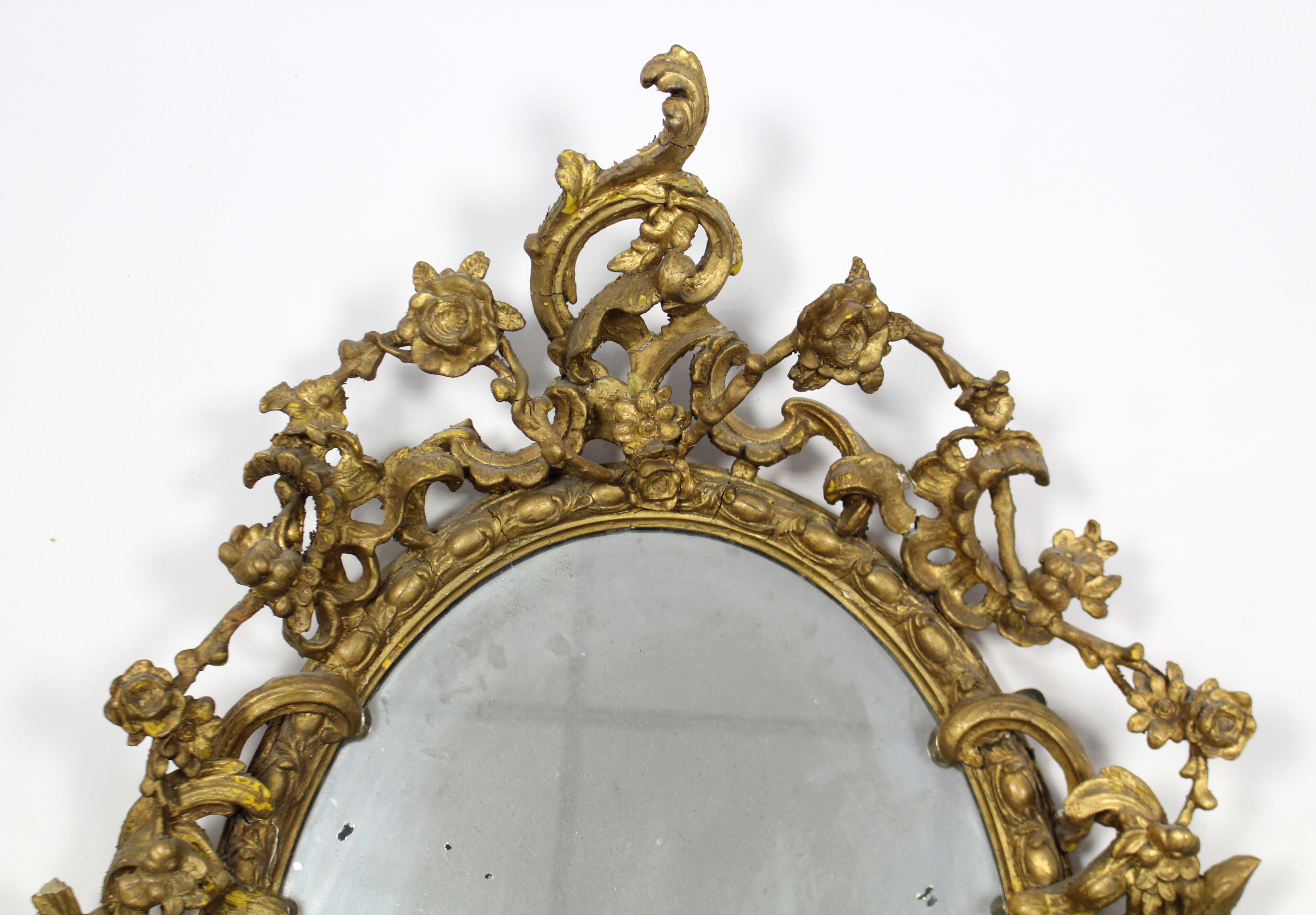 An early 19th century girandole, the oval mirror plate in gilt gesso rococo frame with floral - Image 3 of 5