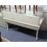 A modern white-finish shop counter display cabinet, the rectangular glazed top enclosed by three