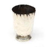 An early 19th century French provincial .950 standard silver beaker with crimped rim, the round ped