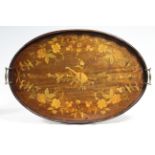 A Victorian mahogany oval tray with shaped raised edge & brass carrying handles, & marquetry