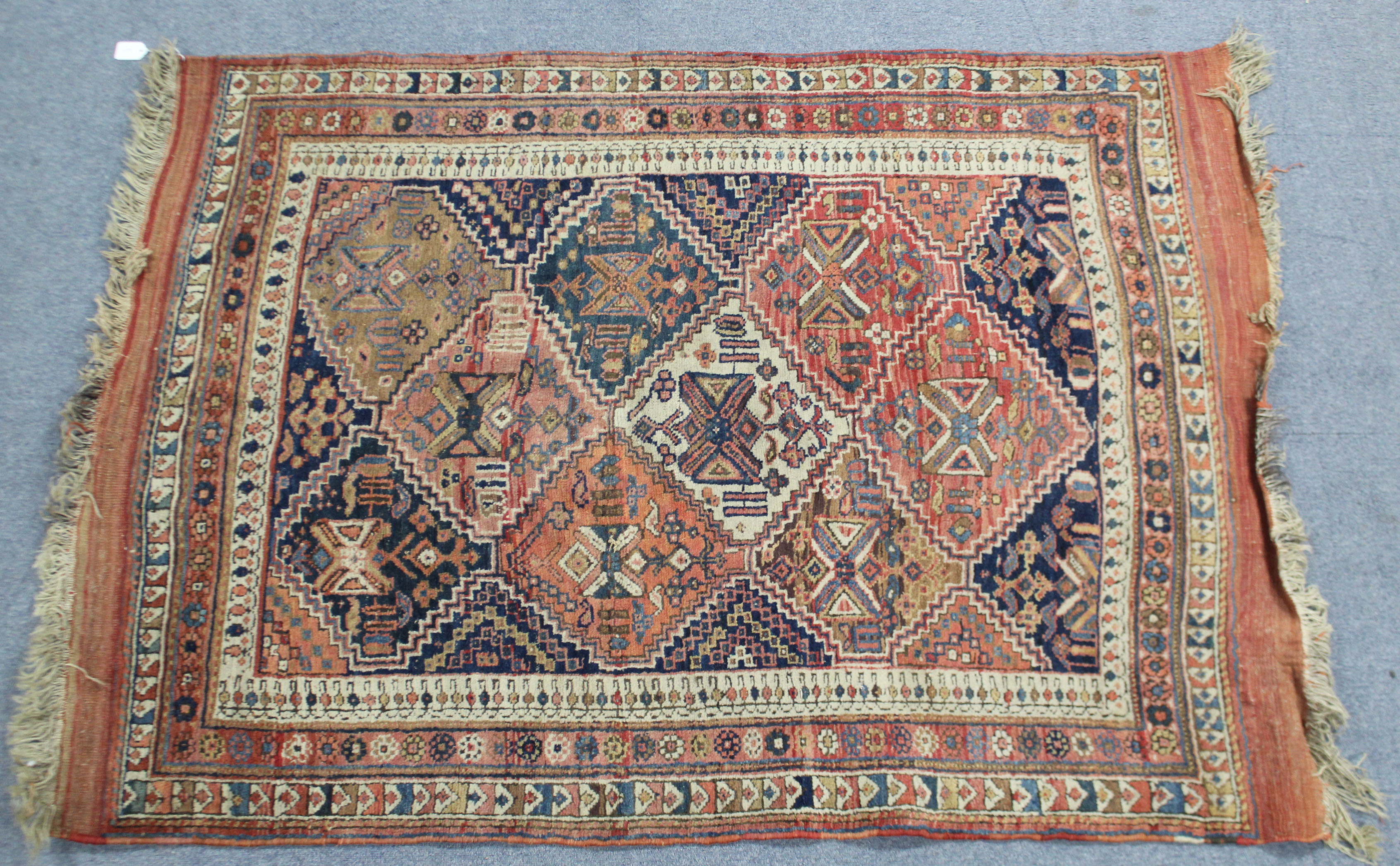 A Persia rug of crimson ground, with repeating geometric lozenge & star pattern within multiple - Image 2 of 2