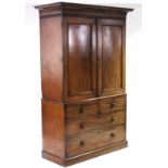 An early Victorian mahogany linen press, the upper part with cavetto cornice & fitted four sliding