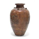 A South-East Asian brown glazed earthenware tall ovoid vase, with short narrow neck & lug handles to