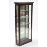 A Victorian mahogany chemist’s display cabinet, fitted five later plate-glass shelves enclosed by