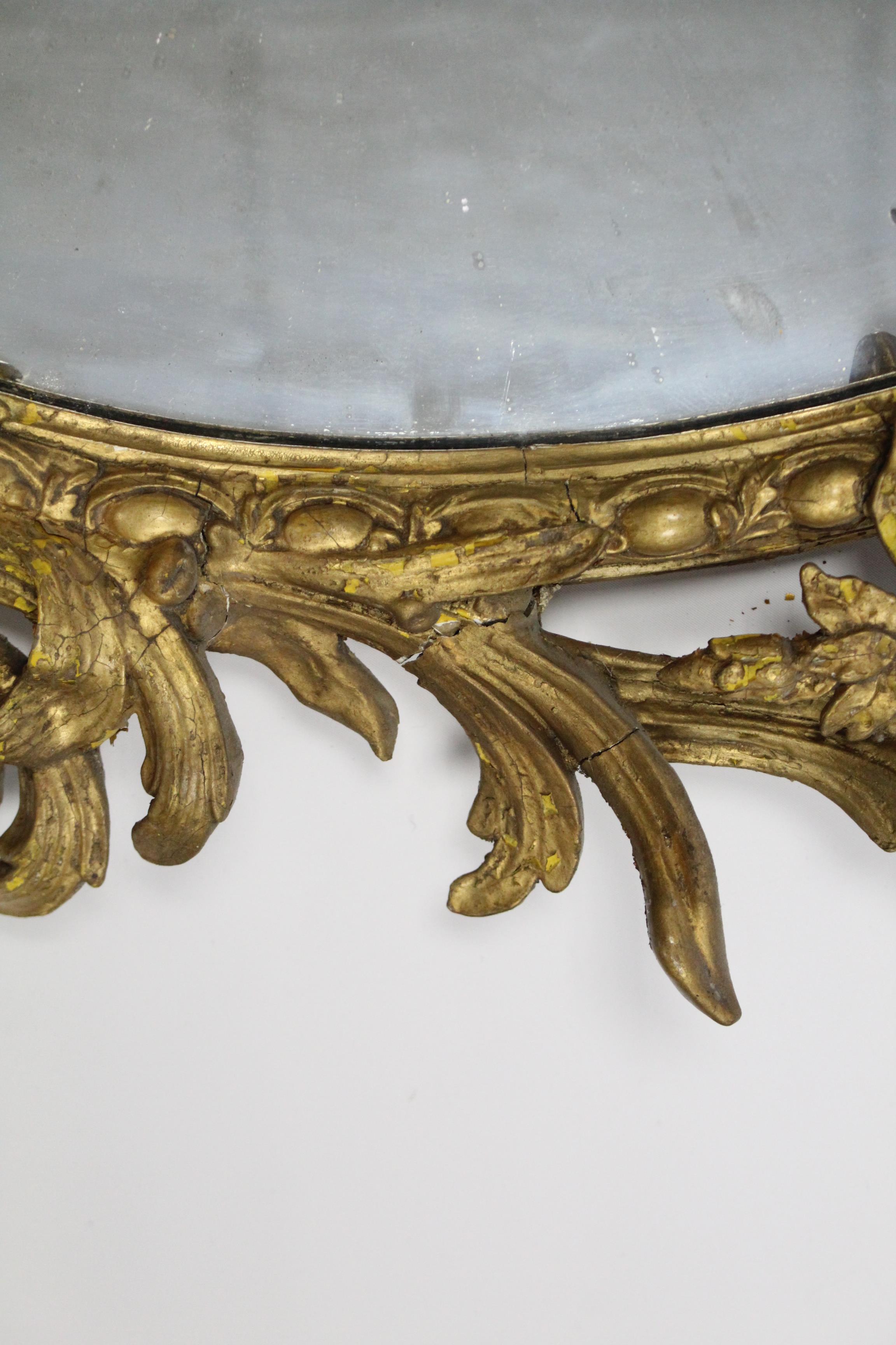 An early 19th century girandole, the oval mirror plate in gilt gesso rococo frame with floral - Image 5 of 5