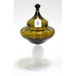 An amber & opaque tinted glass vase with raised female bust to stem & on round pedestal foot, 13”