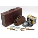 A tan leather suitcase, fitted brass twin-lever locks, 25¾” wide; a Gladstone-type bag; various